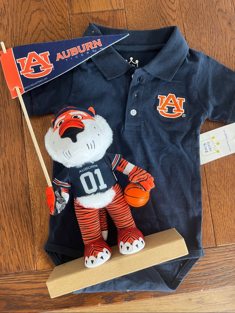 University of Auburn Logo Polo Bodysuit, 18 mos, new with tag.
And Team Mascot!